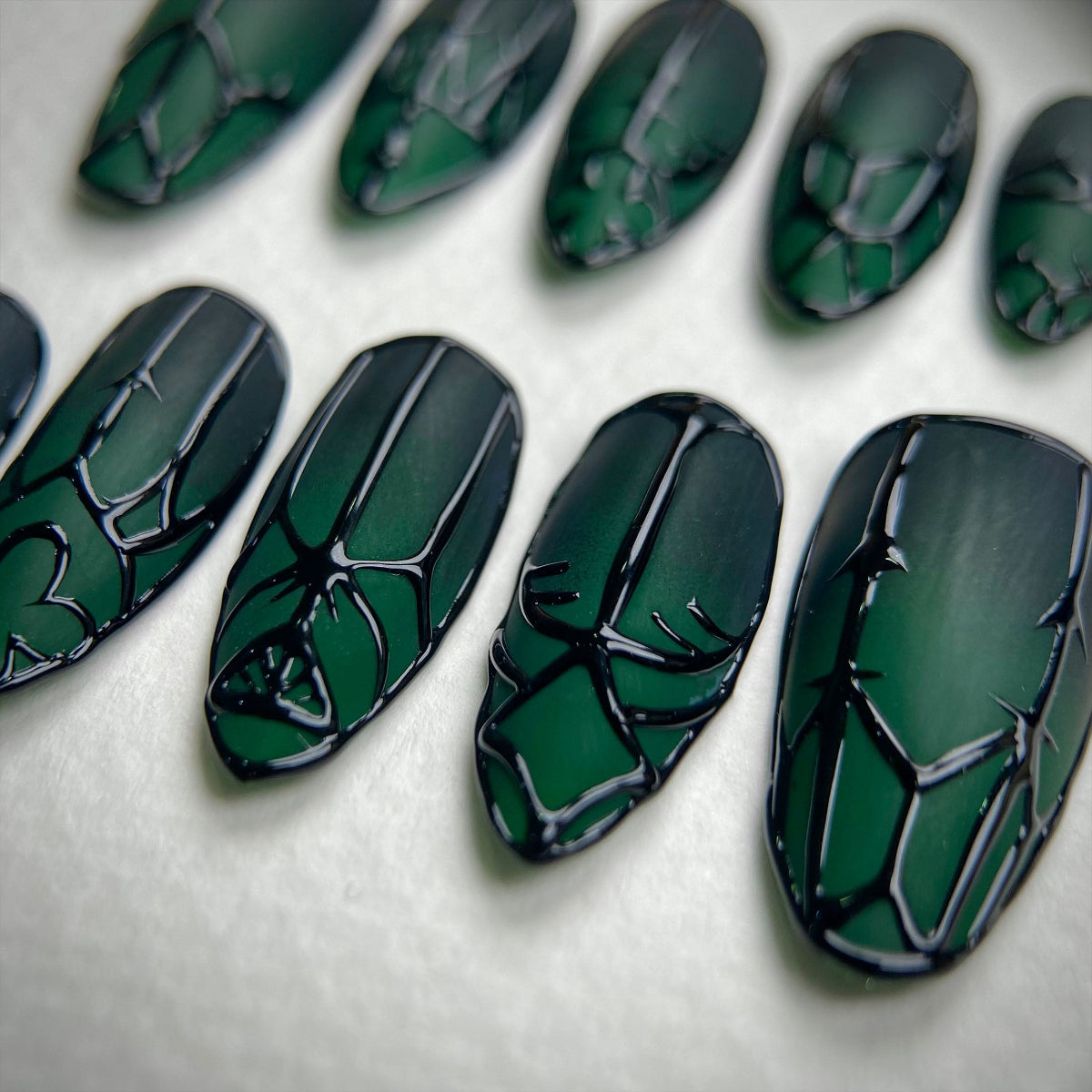 Enchanted Forest Gate Press-On Nails – Matte Green Fake Nails with Gothic Black Symbol Art