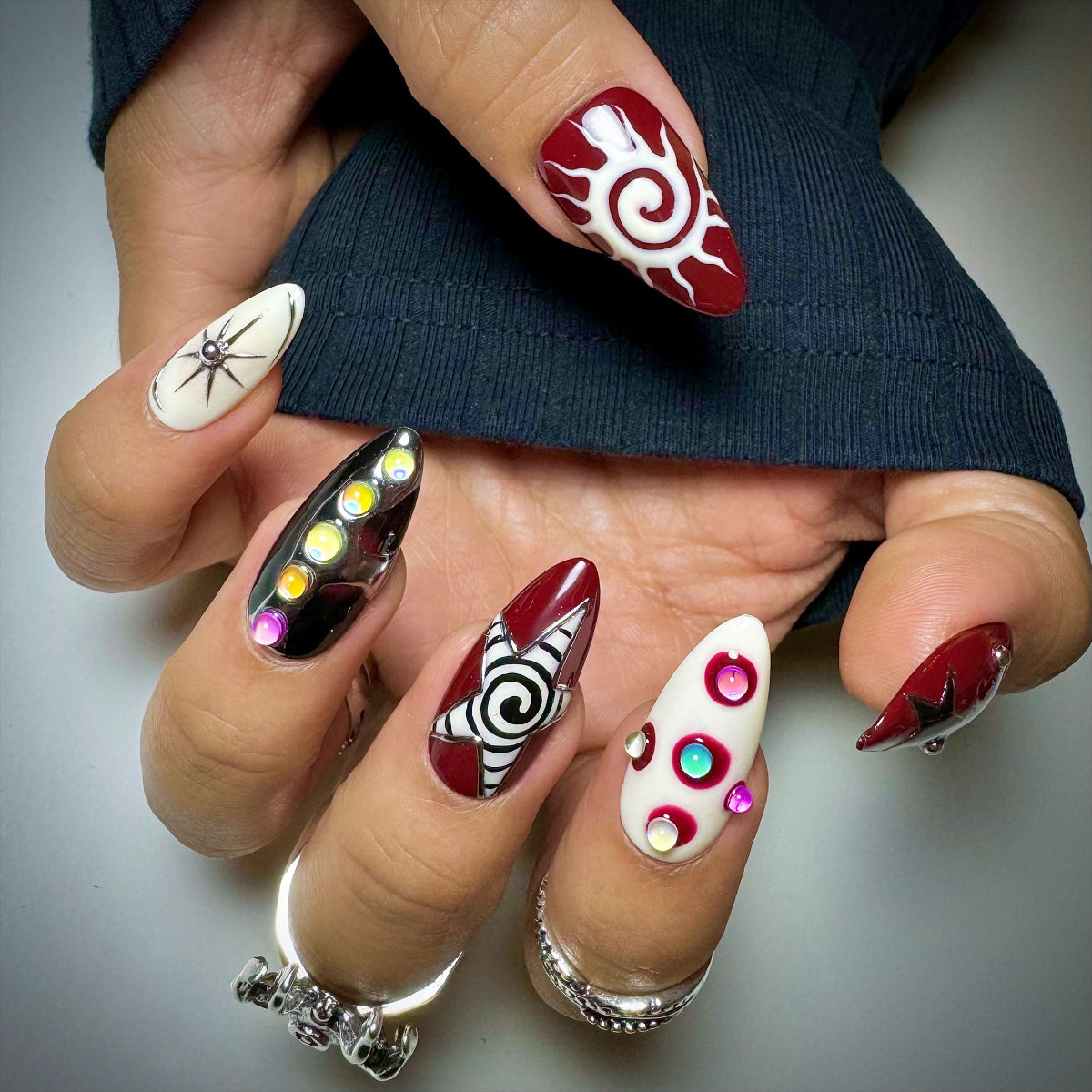 Celestial Chaos Press-On Nails – Burgundy Cream Fake Nails with Sun, Stars & Swirl Designs