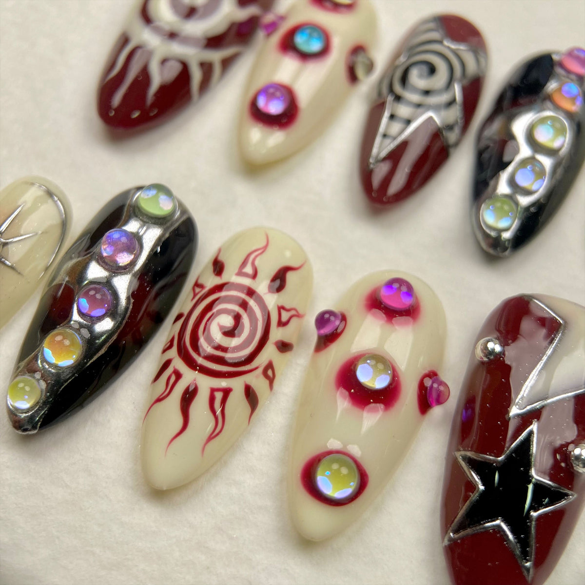 Celestial Chaos Press-On Nails – Burgundy Cream Fake Nails with Sun, Stars & Swirl Designs