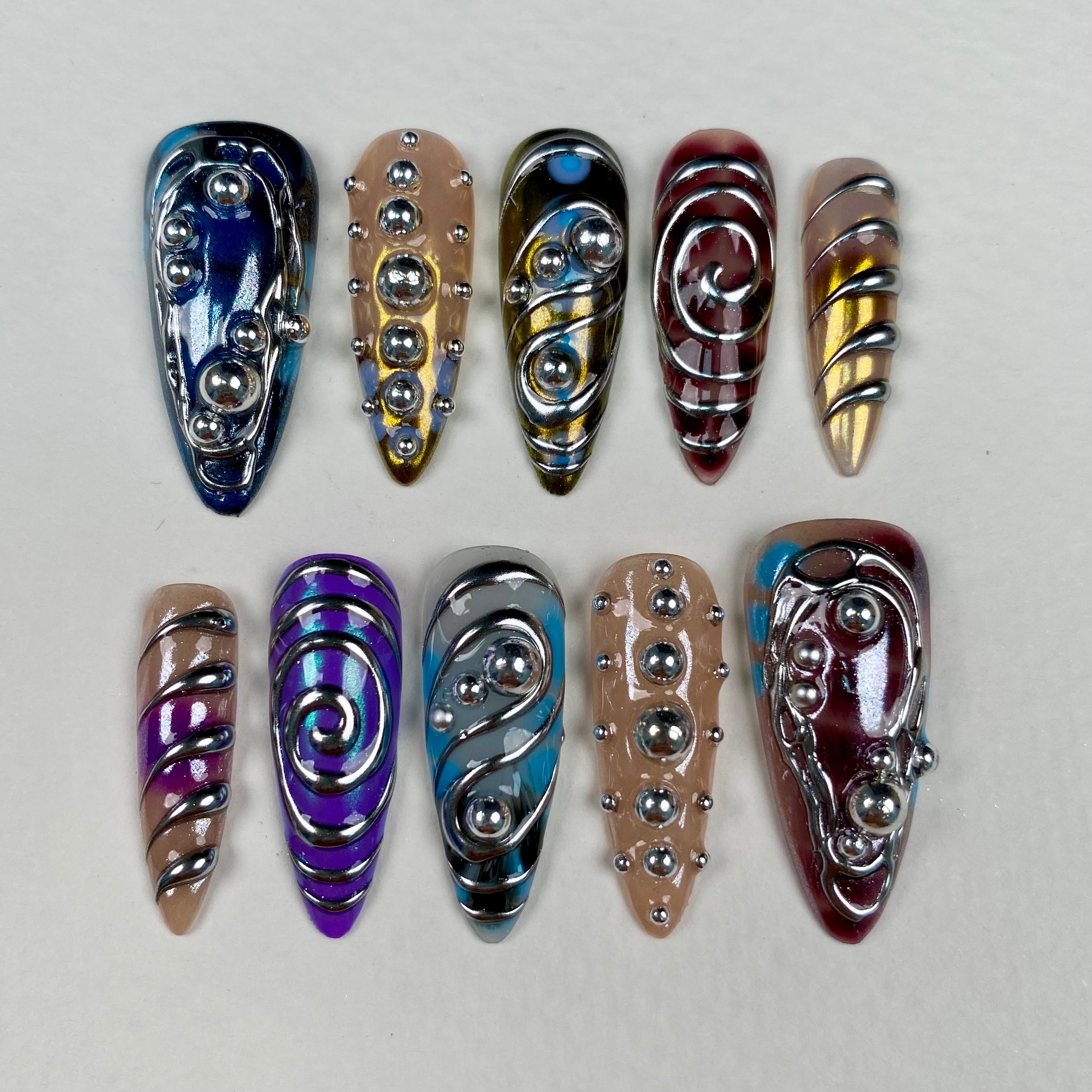 Colorful Silver Chrome Y2K Press-On Nails – 3D Metallic Swirl Cyber Fake Nails