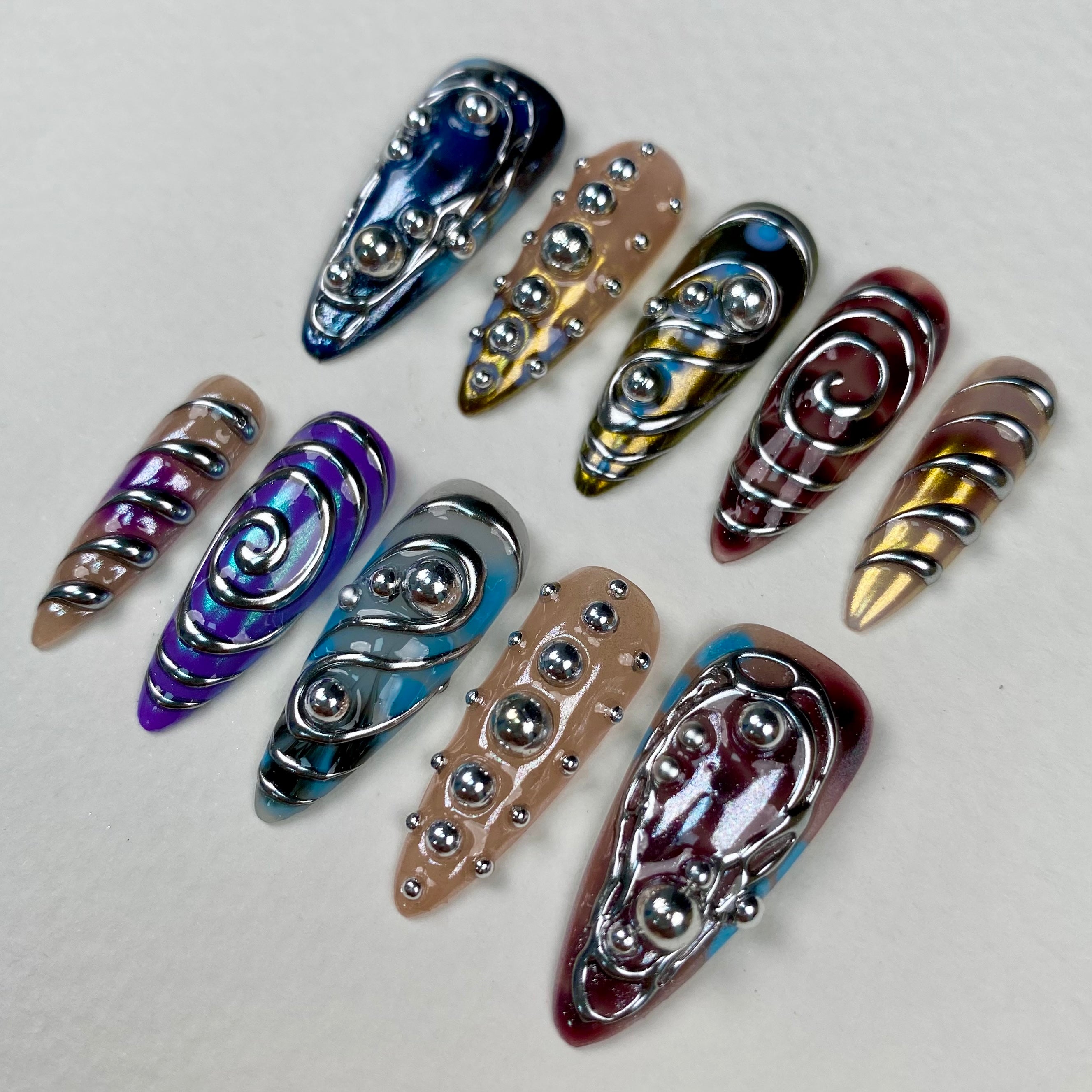 Colorful Silver Chrome Y2K Press-On Nails – 3D Metallic Swirl Cyber Fake Nails